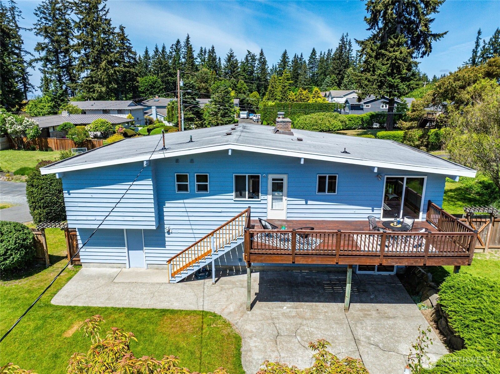 9114 207th Place Southwest Edmonds, WA 98026 - Photo 30 of 36 a view of a house with pool and chairs
