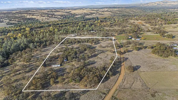 an aerial view of house with yard