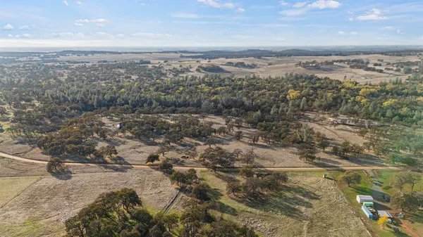 a view of a city with mountains in the background