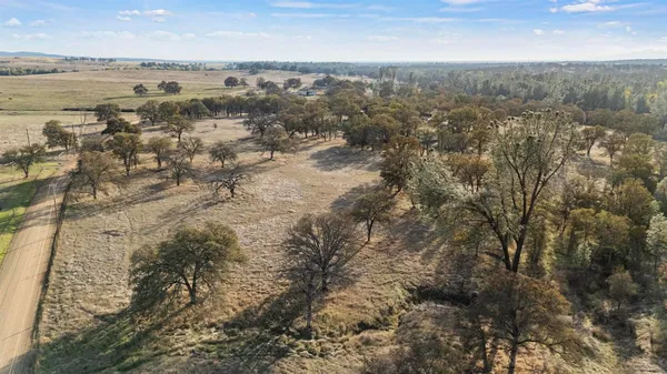 a view of a lake with houses in the back