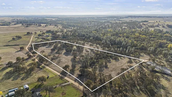 an aerial view of a house with a ocean view