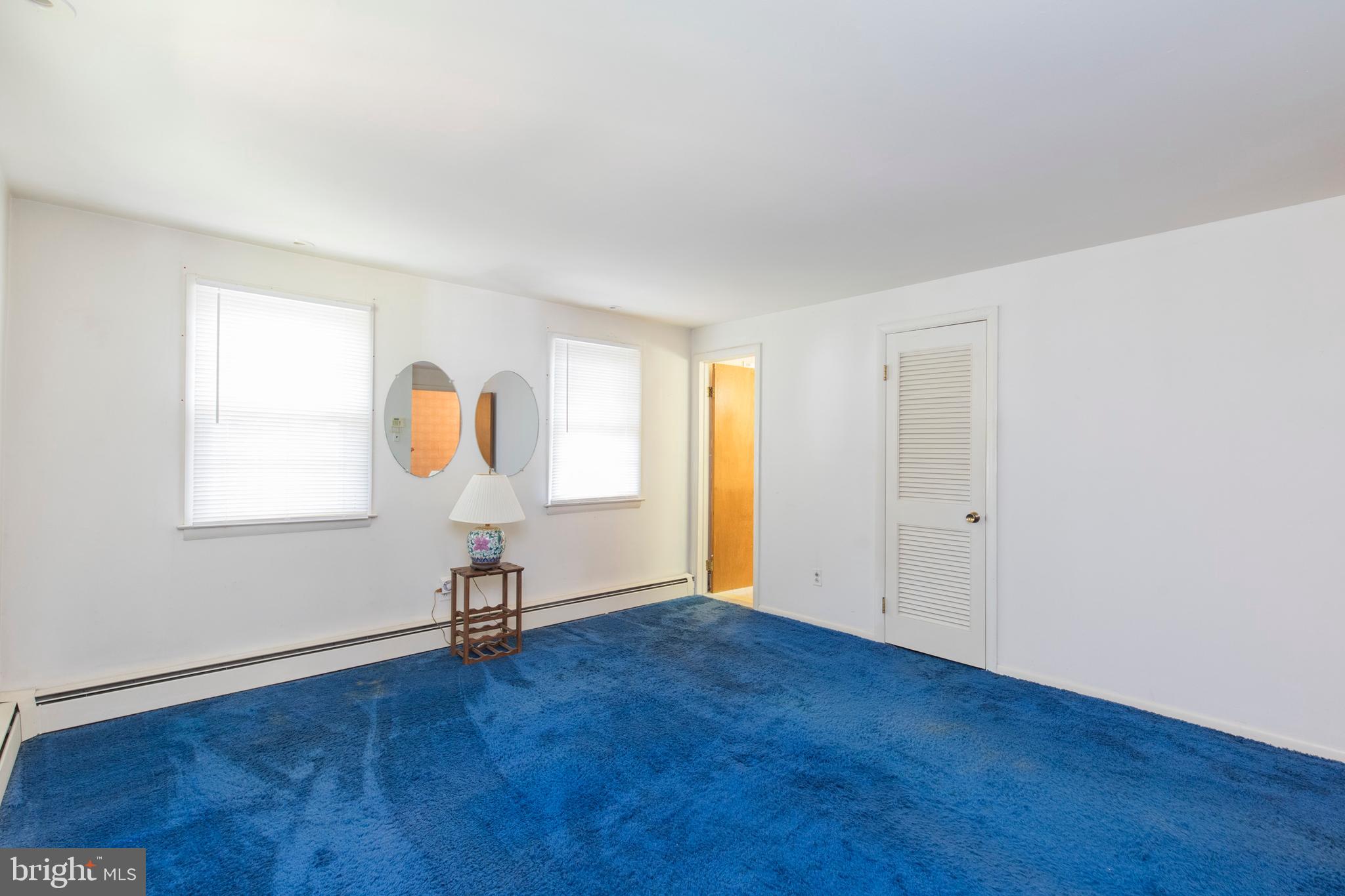 244 Shawnee Road Ardmore, PA 19003 - Photo 19 of 30 an empty room with wooden floor and windows