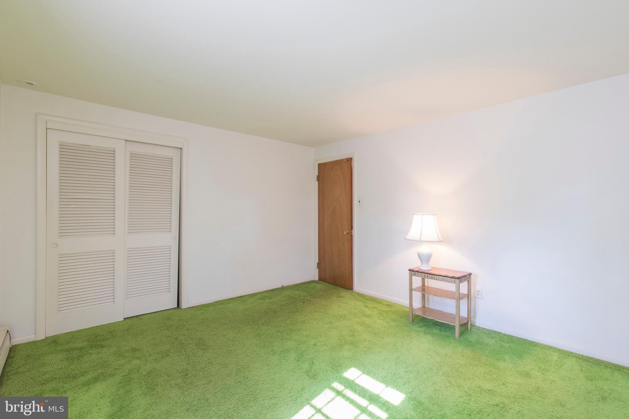 244 Shawnee Road Ardmore, PA 19003 - Photo 24 of 30 a view of an empty room with wooden floor and a window