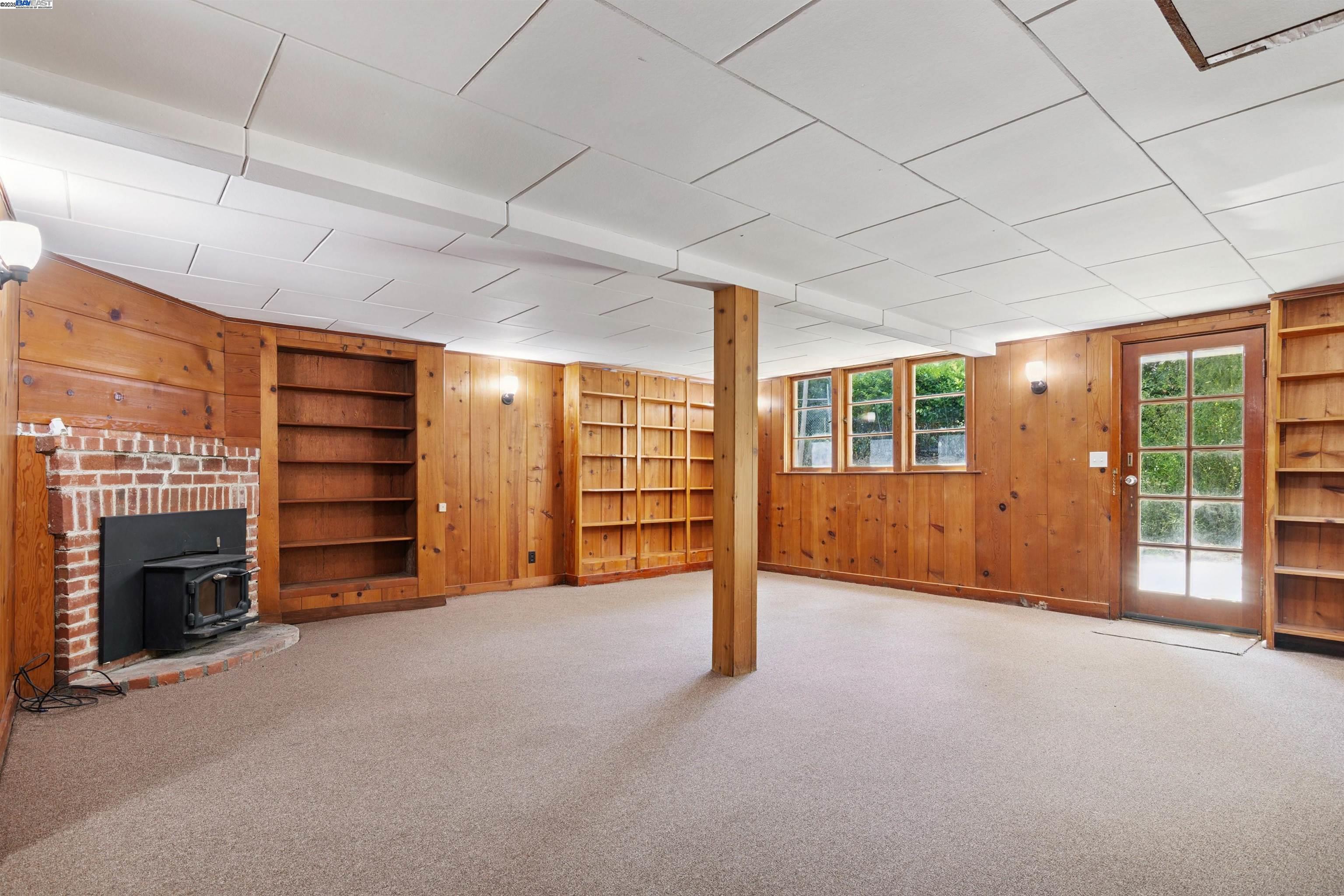 3476 Springhill Road Lafayette, CA 94549 - Photo 22 of 32 a view of an empty room with a fireplace and entryway