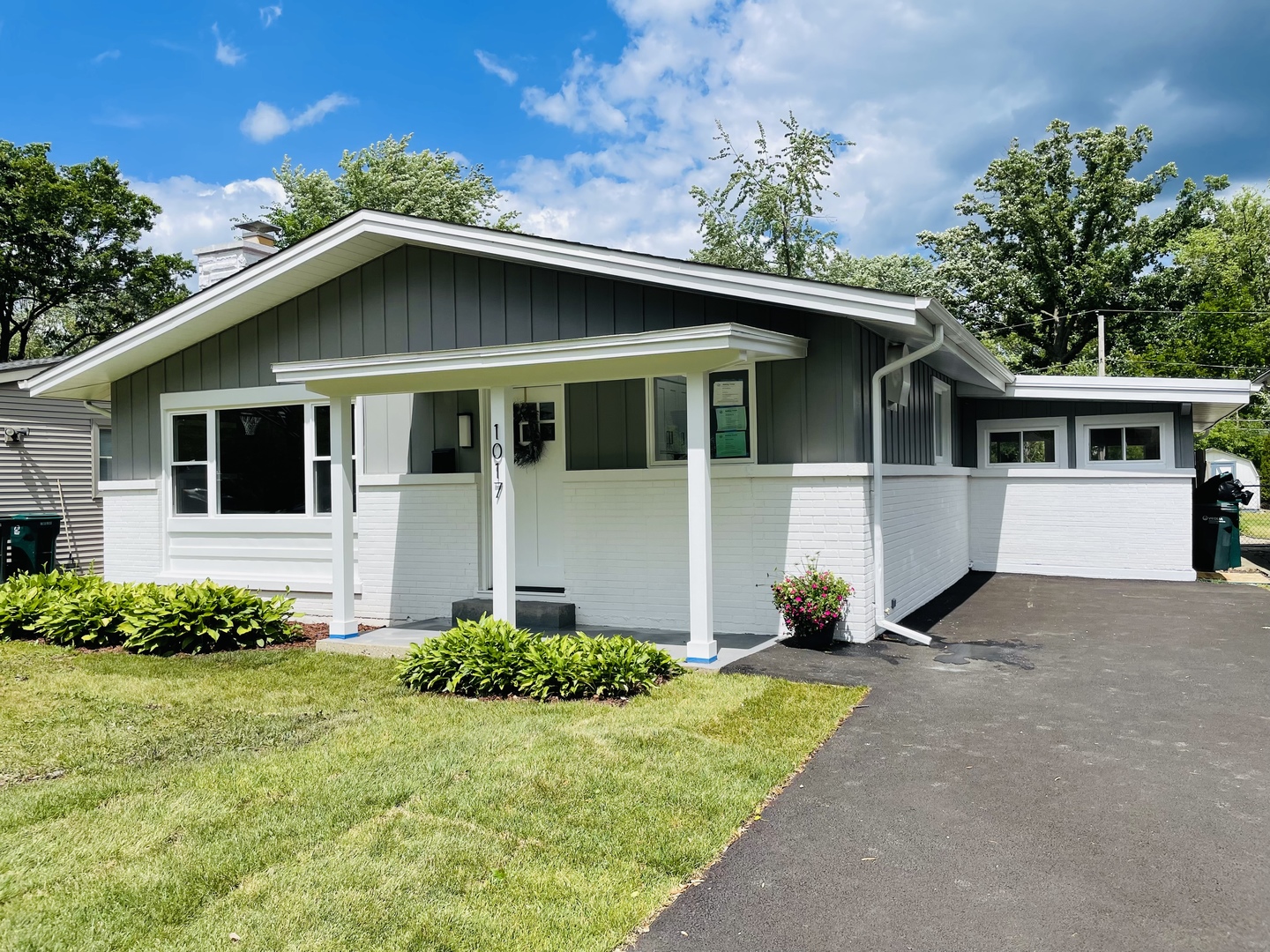 1017 Dell Road Northbrook, IL 60062 - Photo 1 of 52 a front view of a house with garden