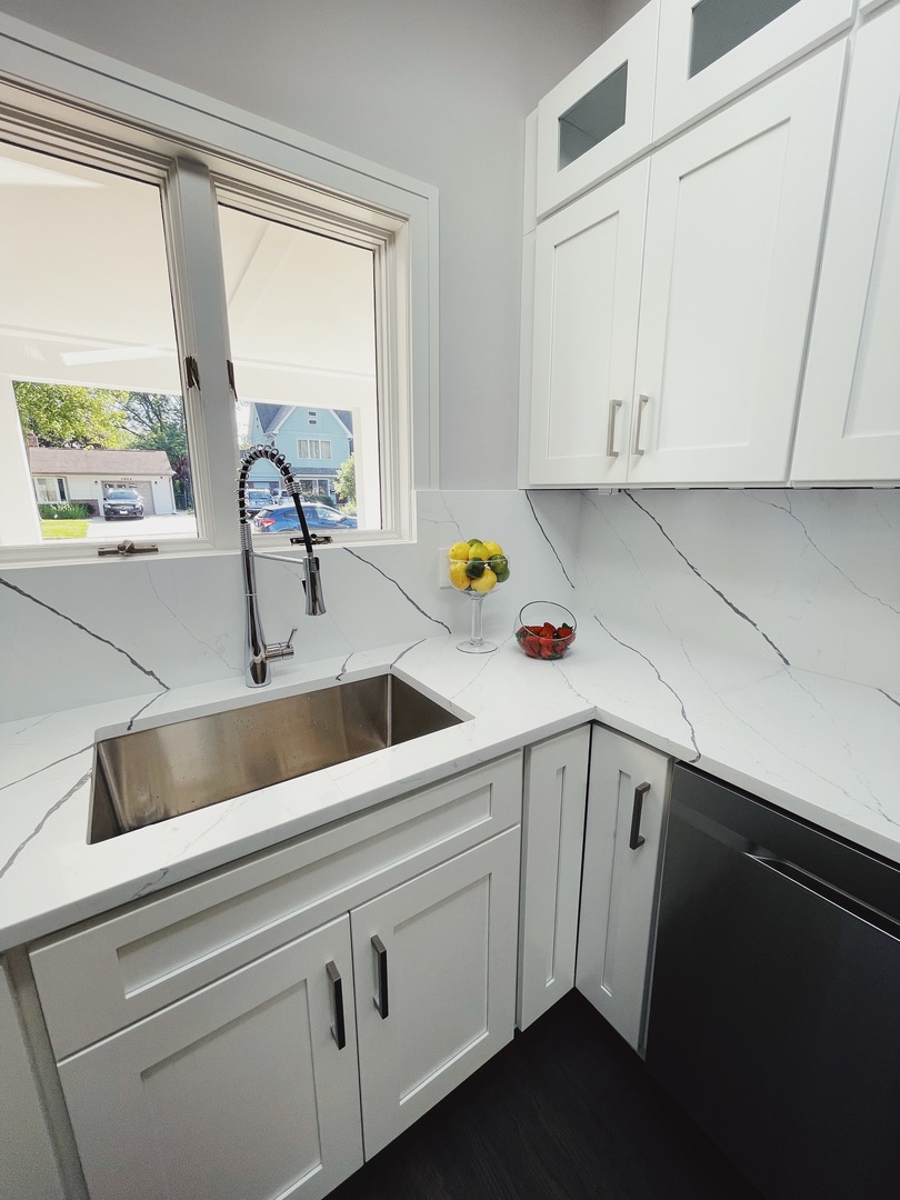 1017 Dell Road Northbrook, IL 60062 - Photo 12 of 52 a kitchen with a sink and cabinets