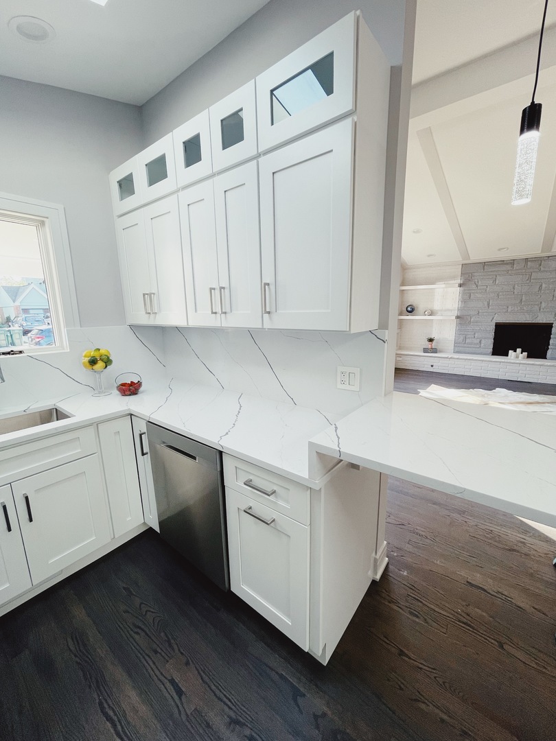 1017 Dell Road Northbrook, IL 60062 - Photo 19 of 52 a kitchen with granite countertop white cabinets and white appliances