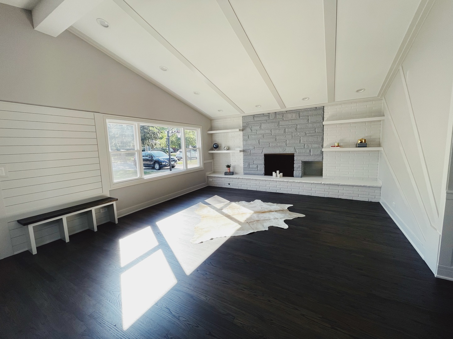 1017 Dell Road Northbrook, IL 60062 - Photo 4 of 52 an empty room with windows wooden floor and fireplace