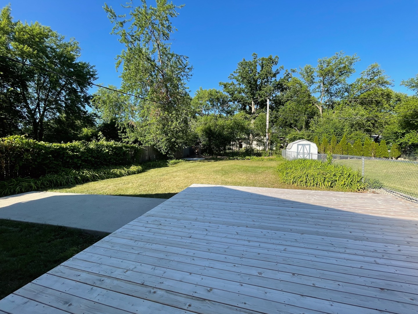 1017 Dell Road Northbrook, IL 60062 - Photo 50 of 52 a view of a swimming pool with an outdoor space and seating area