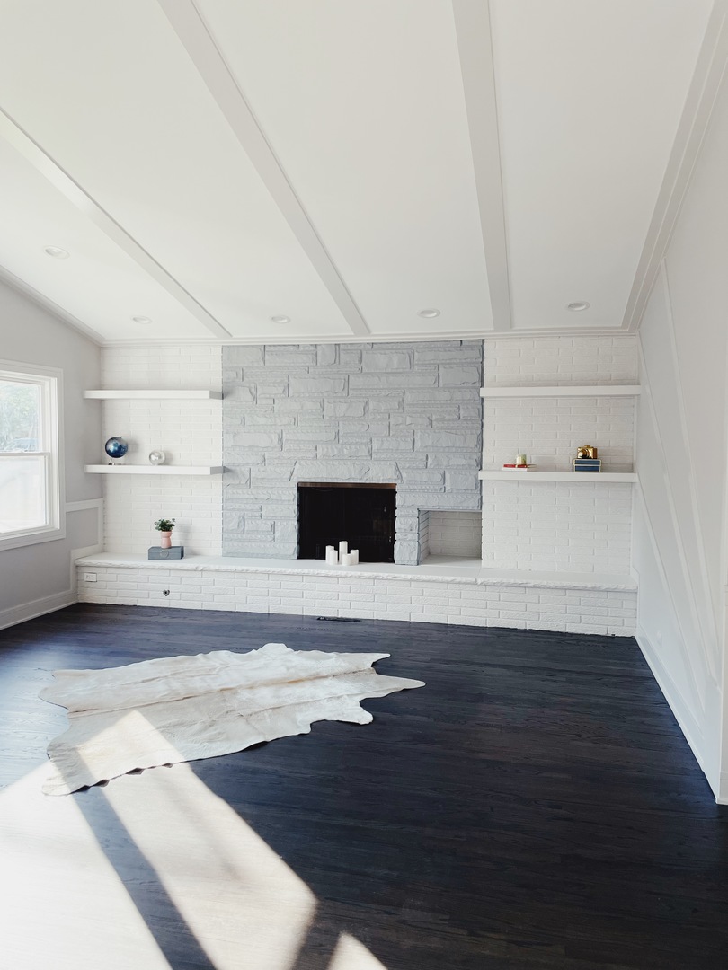 1017 Dell Road Northbrook, IL 60062 - Photo 10 of 52 a living room with furniture and a fireplace