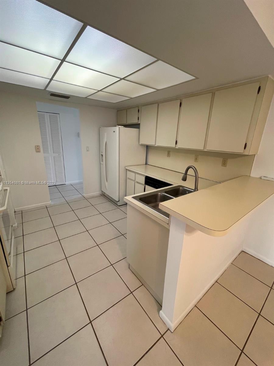 9054 Southwest 112th Place Miami, FL 33176 - Photo 11 of 21 a utility room with dryer and washer