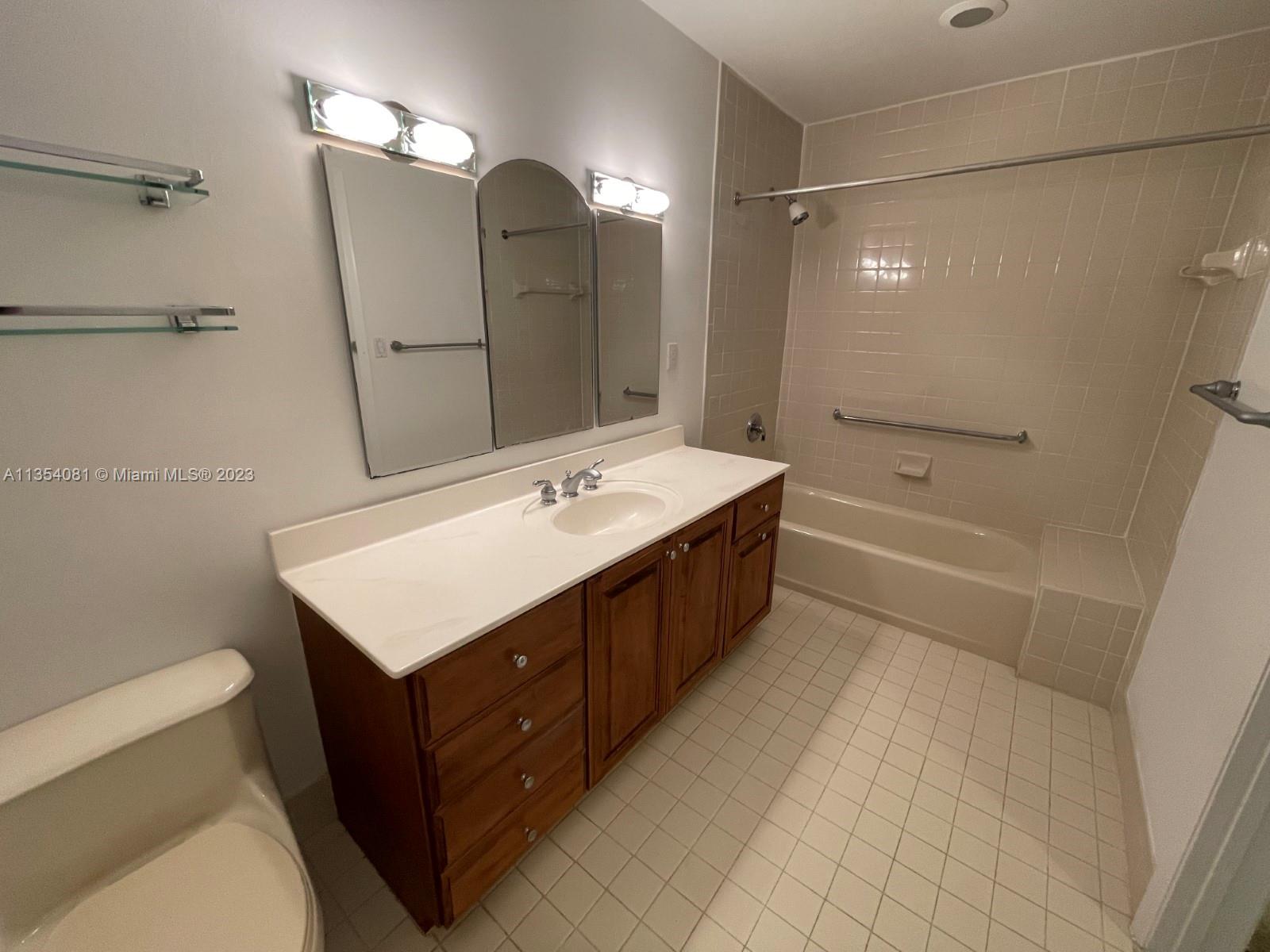 9054 Southwest 112th Place Miami, FL 33176 - Photo 14 of 21 a bathroom with a double vanity sink mirror double and bathtub