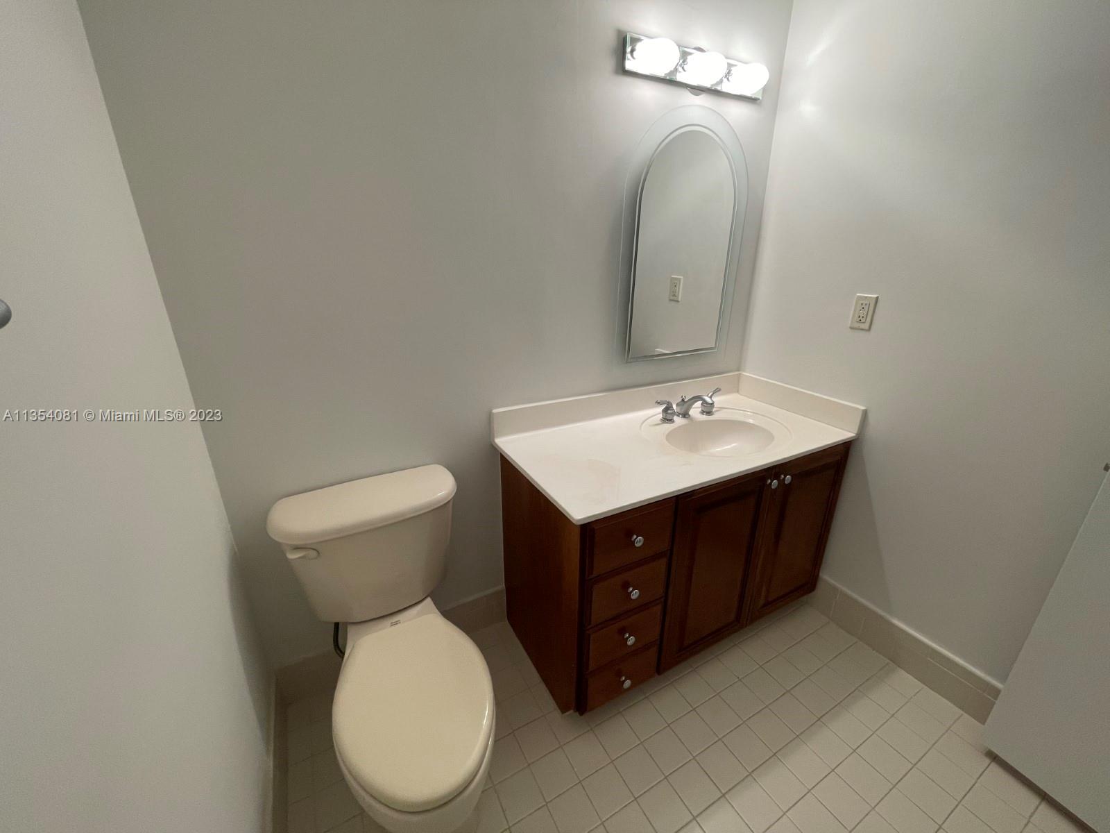 9054 Southwest 112th Place Miami, FL 33176 - Photo 17 of 21 a bathroom with a sink vanity and a toilet