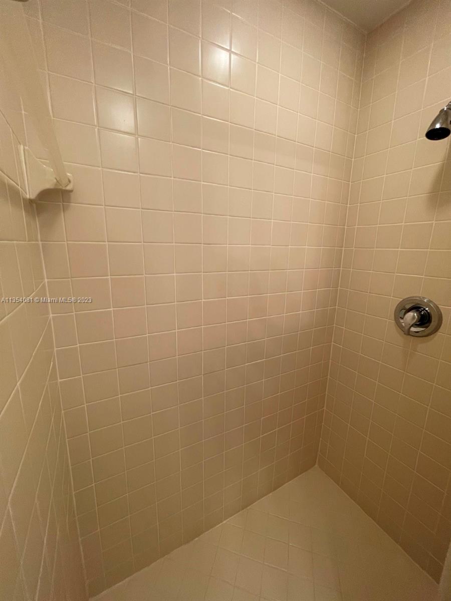 9054 Southwest 112th Place Miami, FL 33176 - Photo 18 of 21 a bathroom with a shower