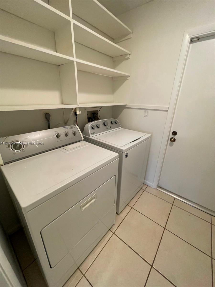 9054 Southwest 112th Place Miami, FL 33176 - Photo 20 of 21 a utility room with dryer and washer
