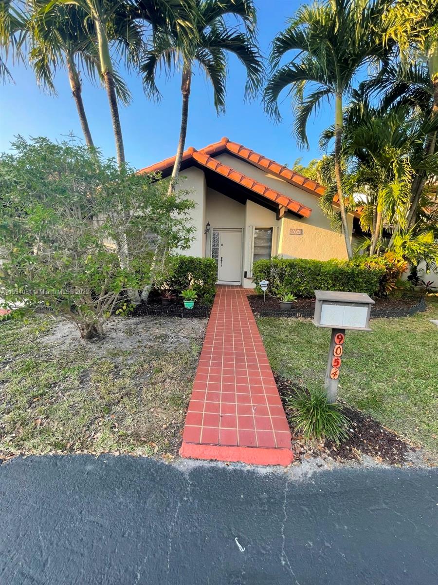 9054 Southwest 112th Place Miami, FL 33176 - Photo 2 of 21 a view of backyard of house with green space