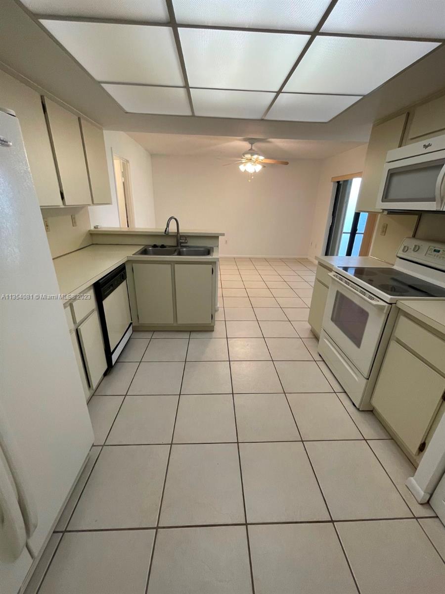 9054 Southwest 112th Place Miami, FL 33176 - Photo 7 of 21 a utility room with cabinets