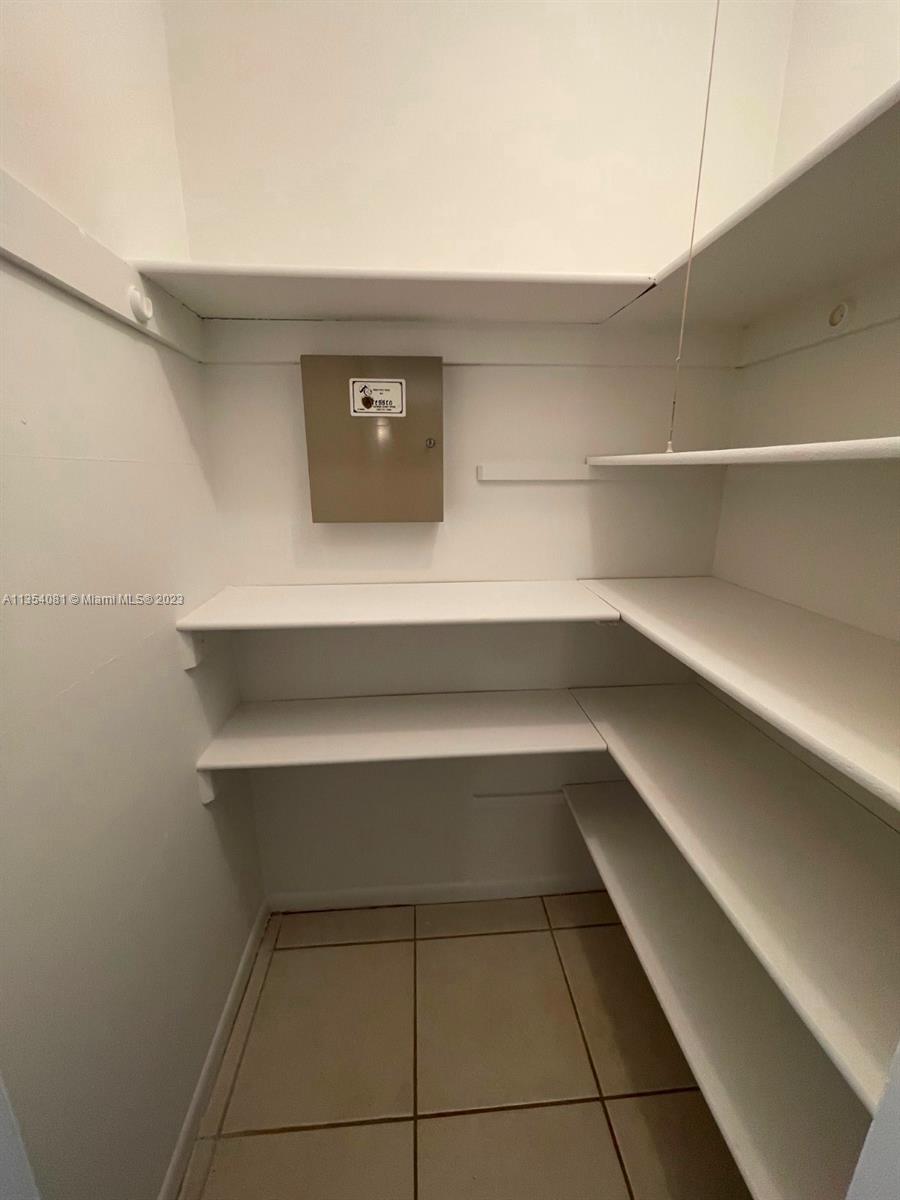 9054 Southwest 112th Place Miami, FL 33176 - Photo 10 of 21 a view of room and empty room with empty racks