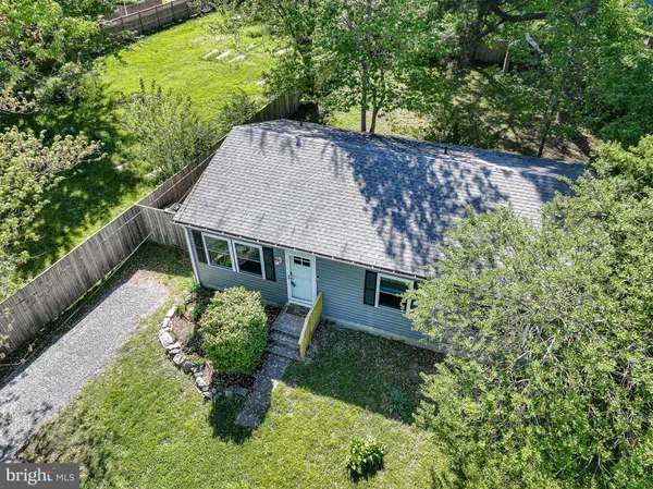 a house with trees in the background