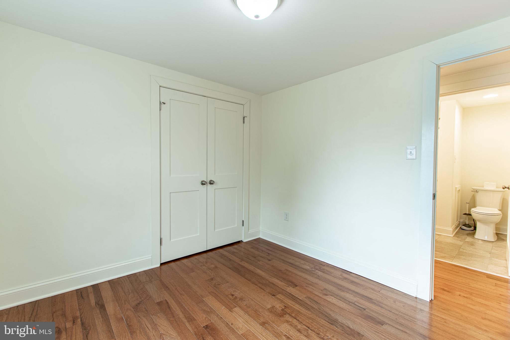 101 Brooks Lane St. Michaels, MD 21663 - Photo 13 of 19 a view of empty room with wooden floor