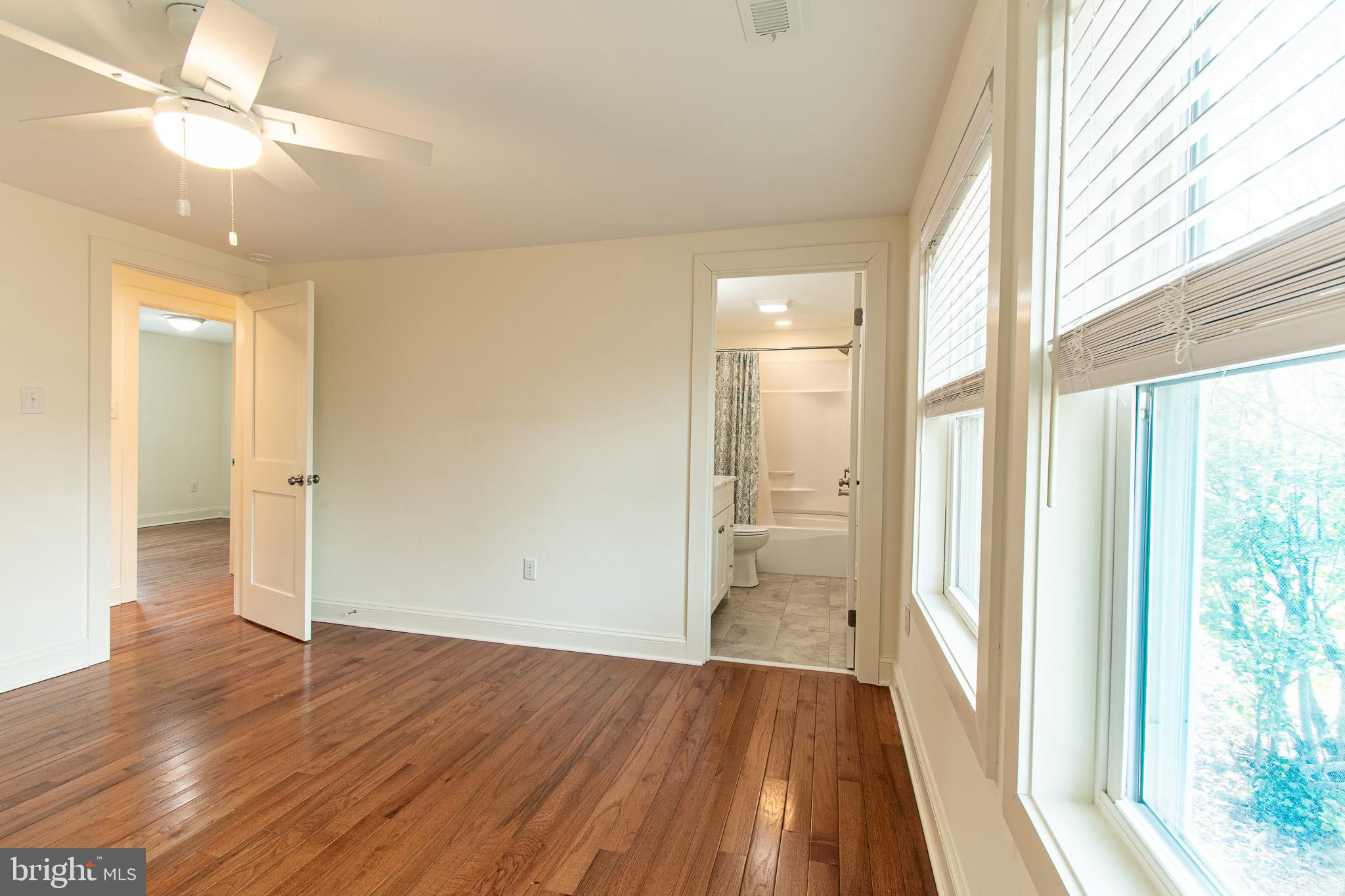 101 Brooks Lane St. Michaels, MD 21663 - Photo 16 of 19 wooden floor in an empty room with a window