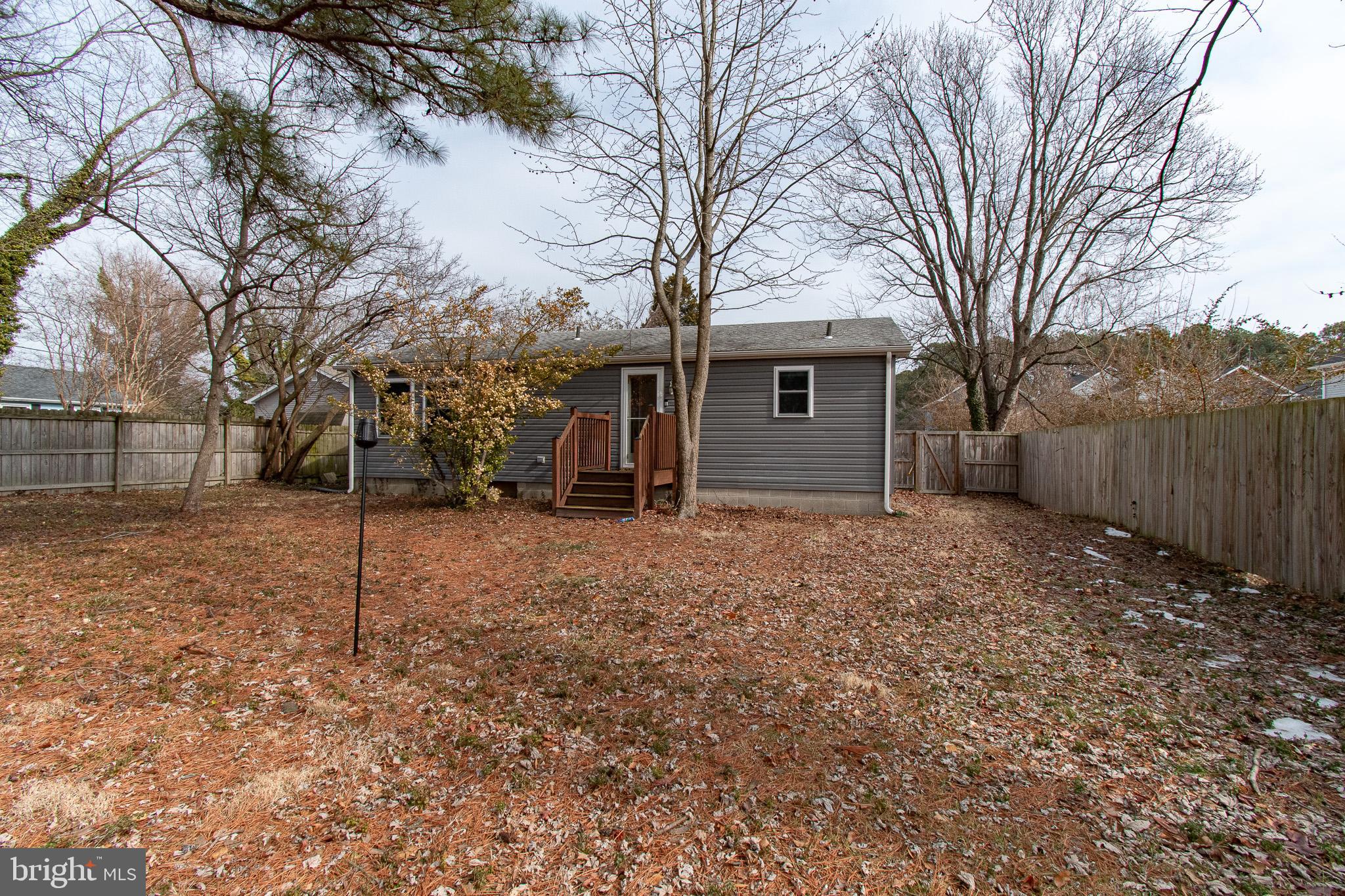 101 Brooks Lane St. Michaels, MD 21663 - Photo 2 of 19 a view of a house with a yard and large tree