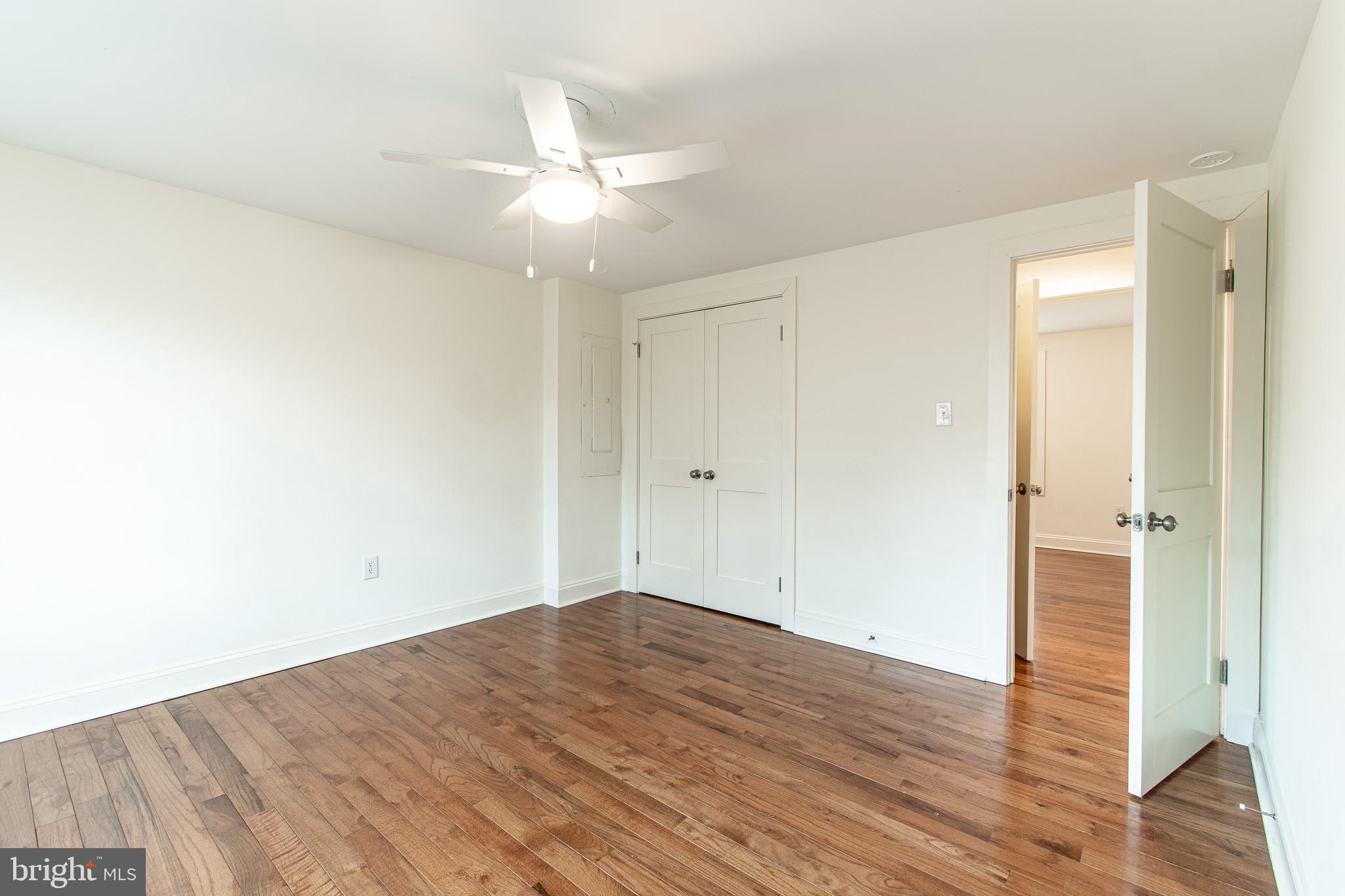 101 Brooks Lane St. Michaels, MD 21663 - Photo 21 of 28 an empty room with wooden floor and fan