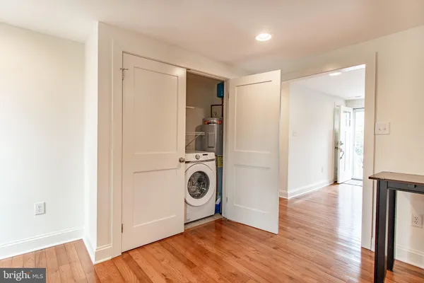 a view of an empty room and wooden floor