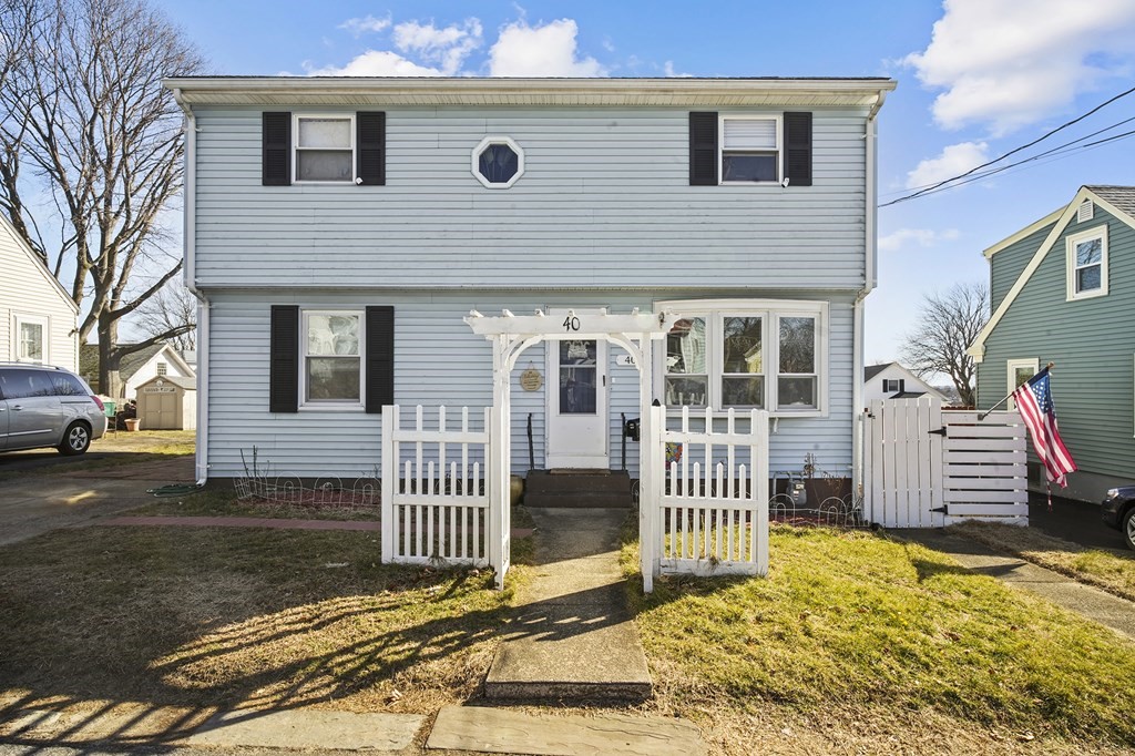 40 Harrison Street Cumberland, RI 02864 - Photo 1 of 37 a front view of a house with a garden
