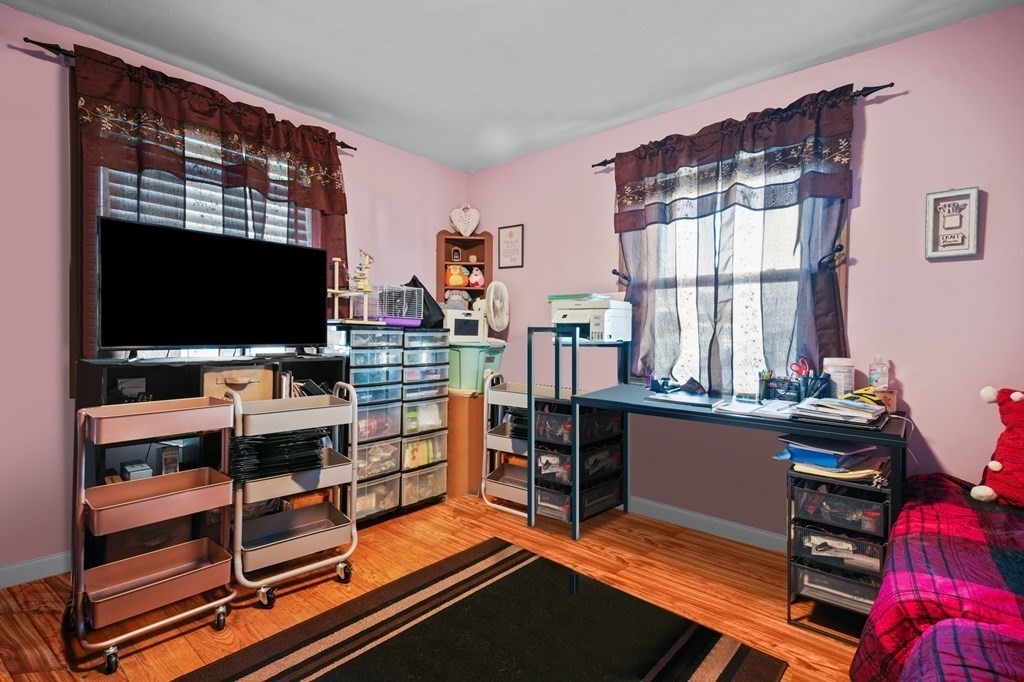 40 Harrison Street Cumberland, RI 02864 - Photo 12 of 37 a room with furniture and a flat screen tv