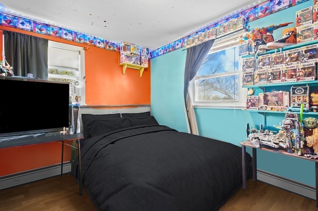 40 Harrison Street Cumberland, RI 02864 - Photo 15 of 37 a bedroom with a bed and a flat screen tv