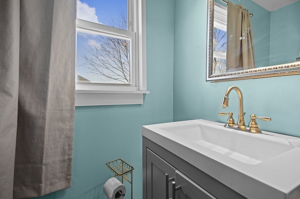40 Harrison Street Cumberland, RI 02864 - Photo 16 of 37 a bathroom with a sink and a toilet