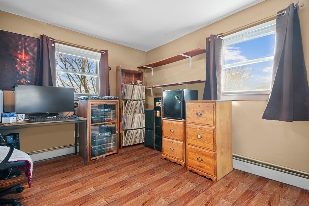 40 Harrison Street Cumberland, RI 02864 - Photo 17 of 37 a kitchen with cabinets and wooden floor