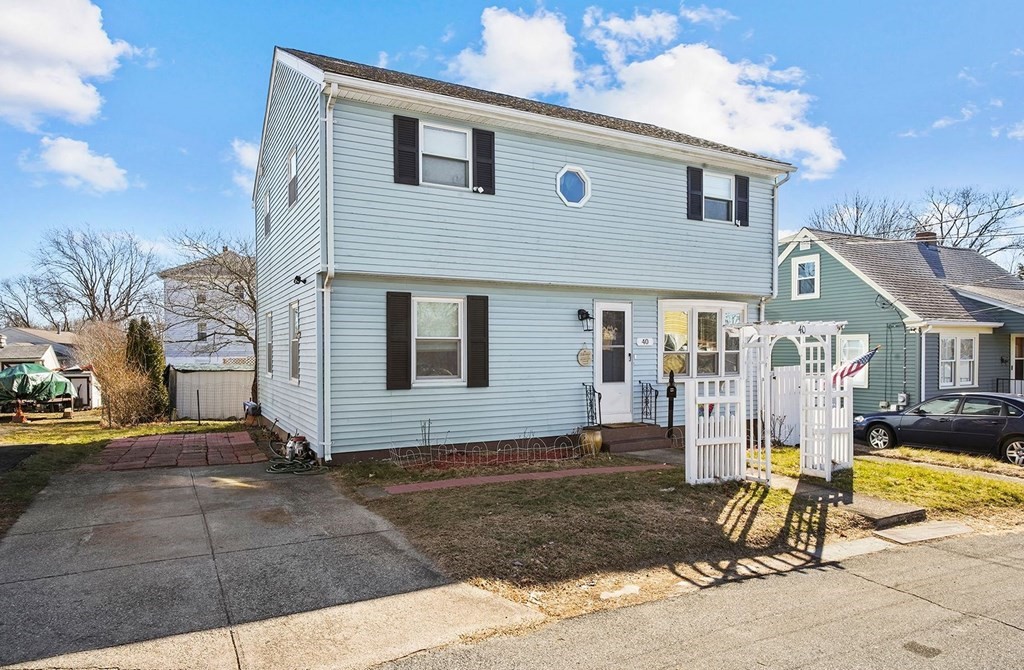 40 Harrison Street Cumberland, RI 02864 - Photo 2 of 37 a front view of a house with a yard