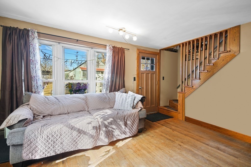 40 Harrison Street Cumberland, RI 02864 - Photo 5 of 37 a living room with furniture and a large window