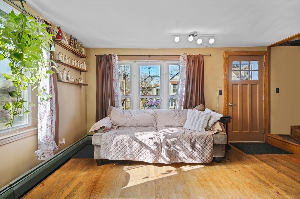40 Harrison Street Cumberland, RI 02864 - Photo 6 of 37 a living room with furniture and a window