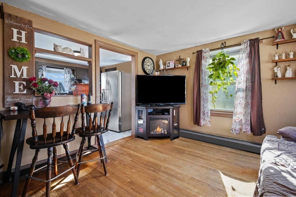 40 Harrison Street Cumberland, RI 02864 - Photo 8 of 37 a view of a livingroom with furniture and a flat screen tv