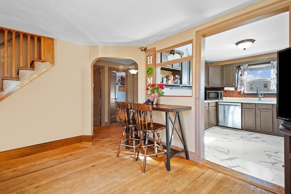 40 Harrison Street Cumberland, RI 02864 - Photo 9 of 37 a view of a dining room with furniture and wooden floor
