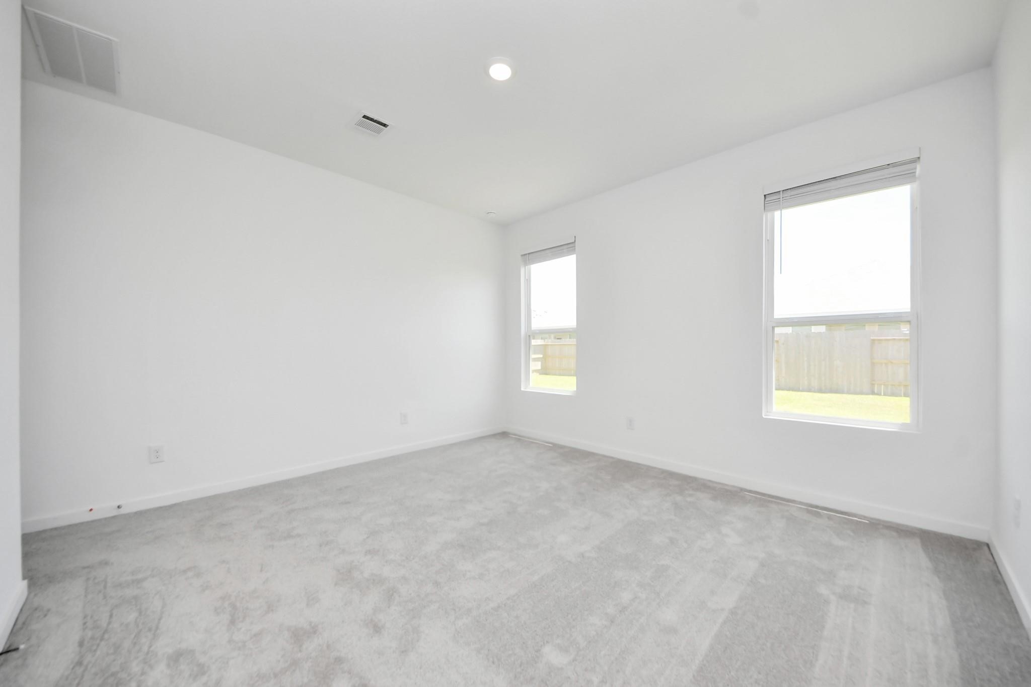 10650 Ellerston Road Cleveland, TX 77327 - Photo 17 of 25 Enjoy extra privacy with the primary bedroom separate from the two additional bedrooms (2nd bedroom)