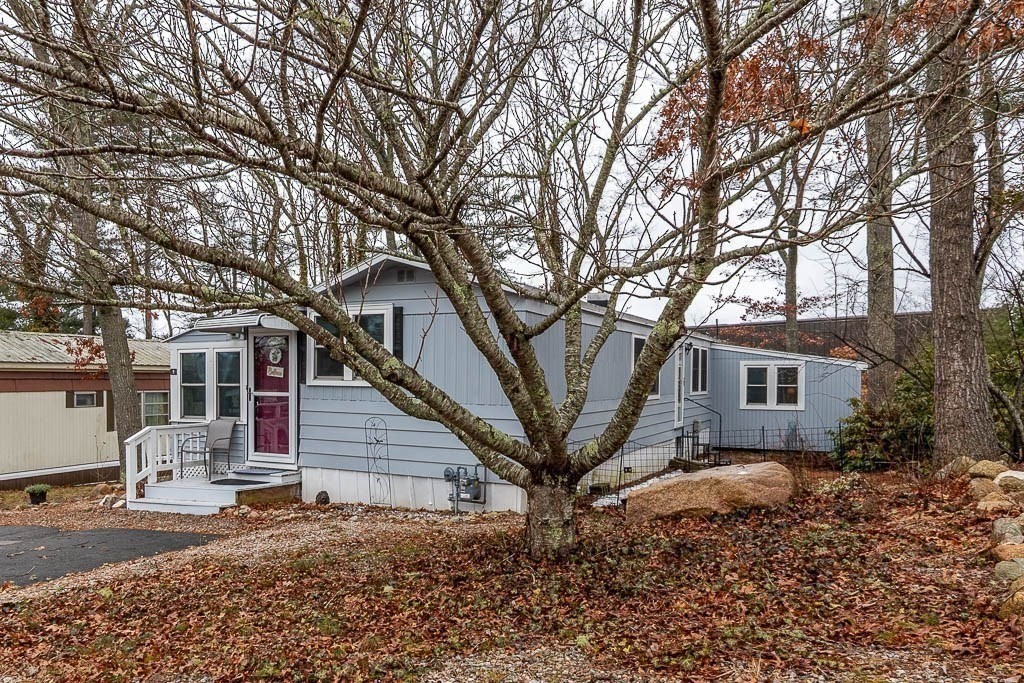 5 Timber Lane Wareham, MA 02571 - Photo 6 of 31 a front view of a house with a tree