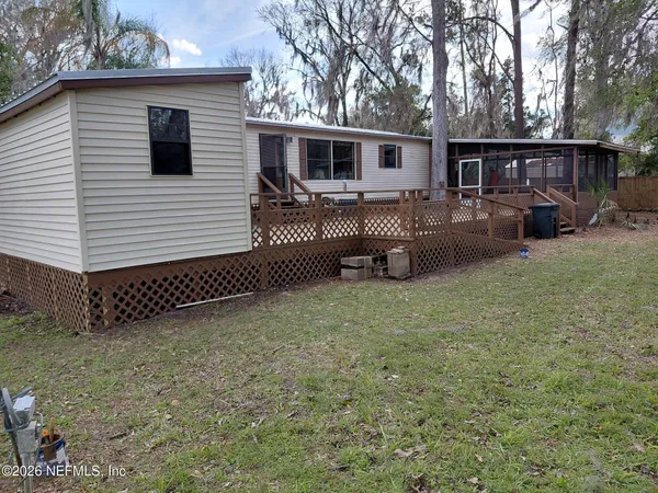 a view of a house with backyard