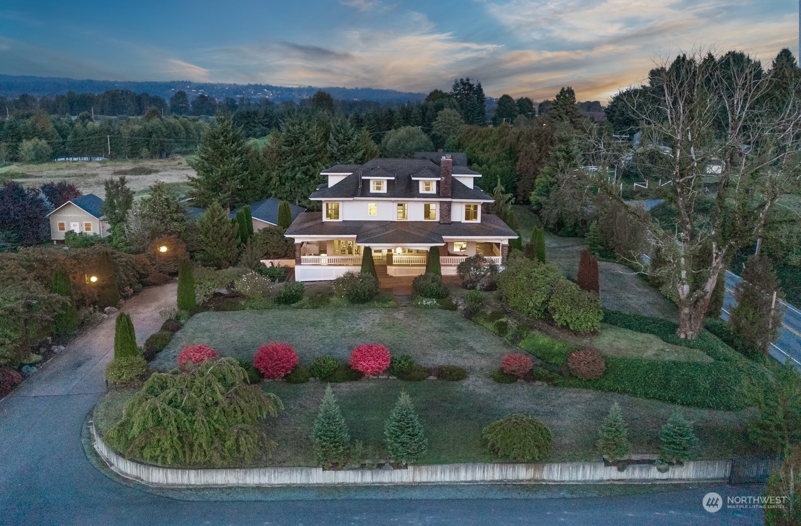 a aerial view of a house with a yard