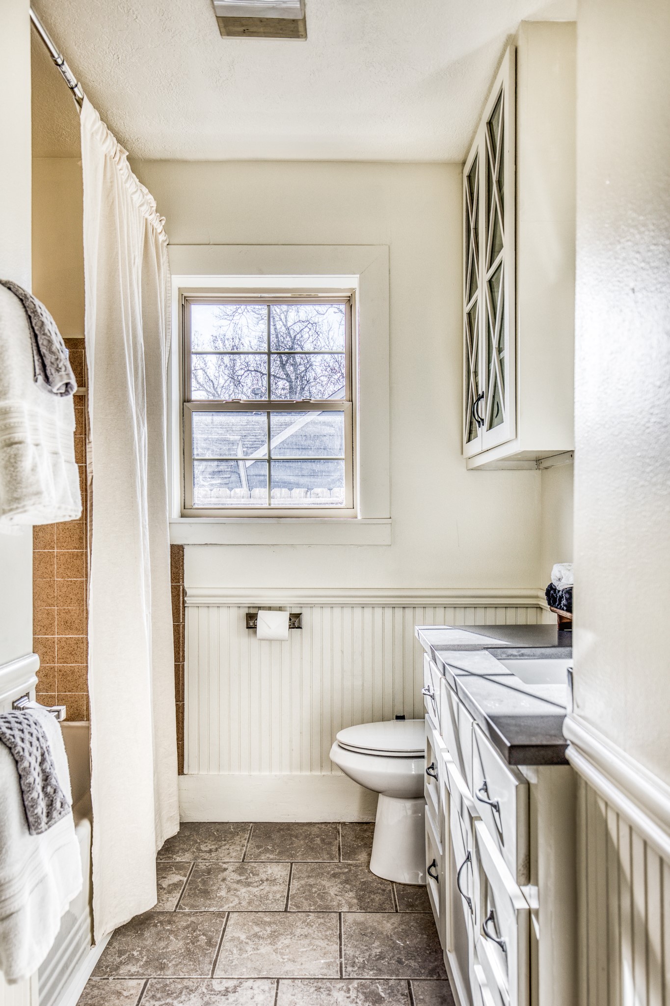 602 Alma Street Brenham, TX 77833 - Photo 12 of 20 a bathroom with a sink a toilet and a shower