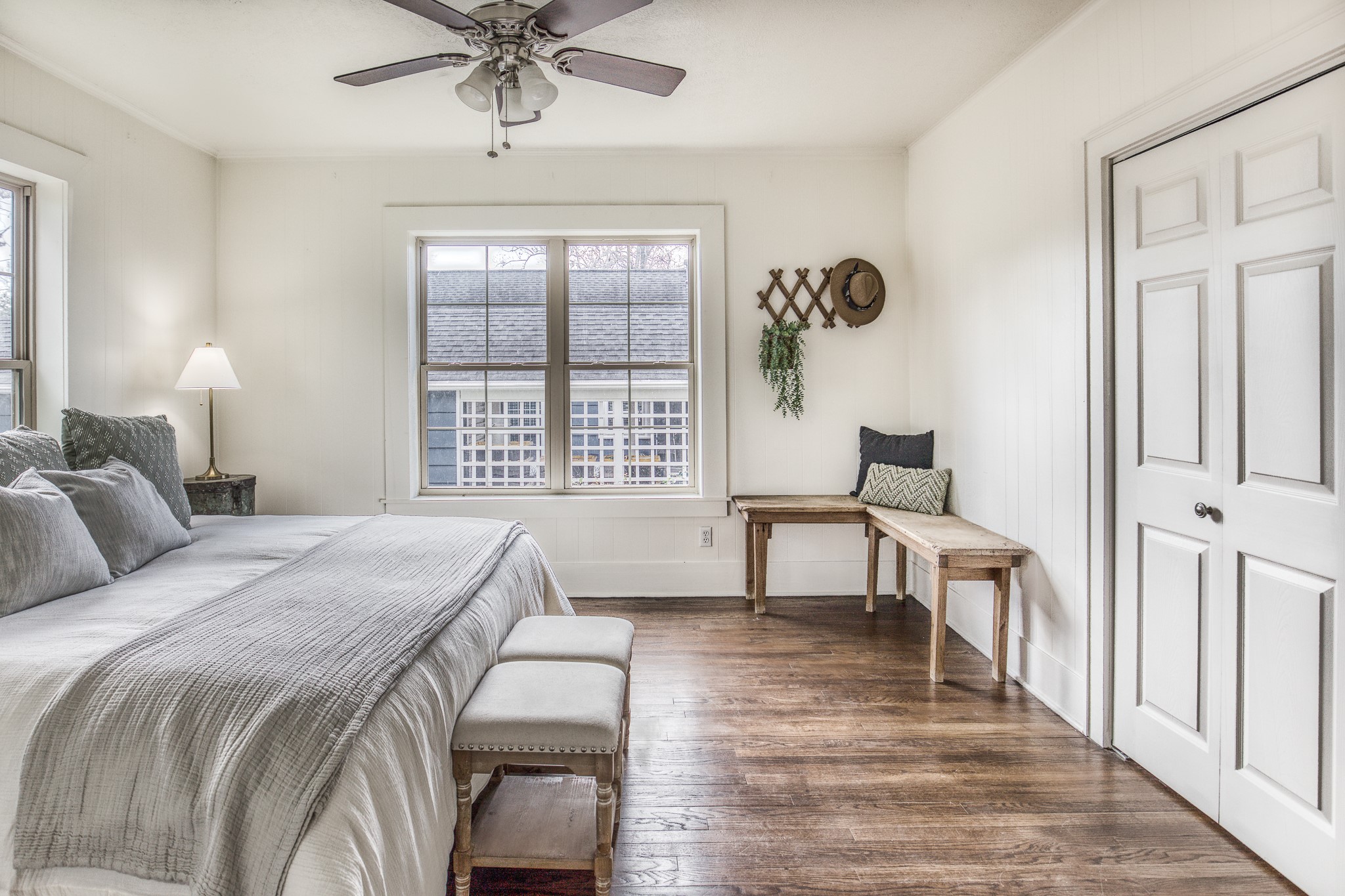 602 Alma Street Brenham, TX 77833 - Photo 17 of 20 a bedroom with a bed and a table in it