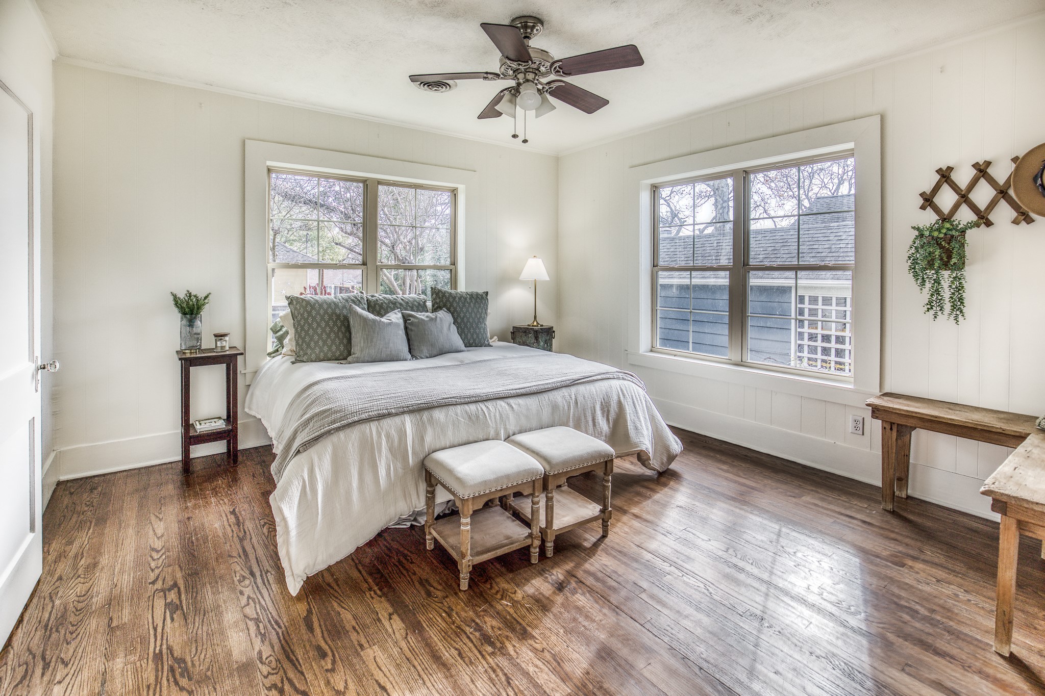 602 Alma Street Brenham, TX 77833 - Photo 18 of 20 a bedroom with a bed a window with wooden floor