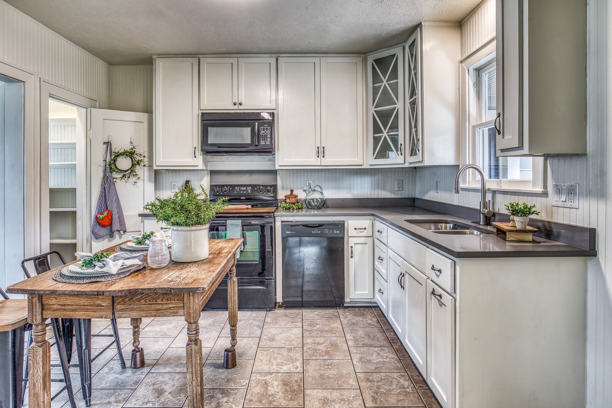 602 Alma Street Brenham, TX 77833 - Photo 9 of 20 a kitchen with stainless steel appliances granite countertop a stove top oven a sink dishwasher and cabinets with wooden floor