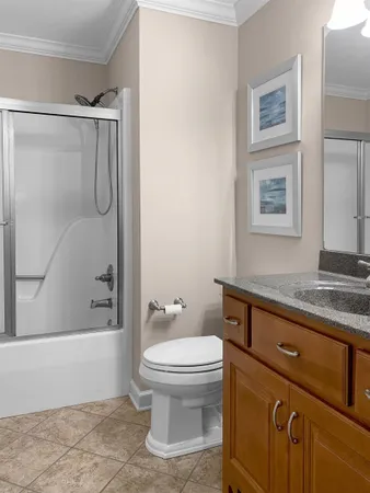 a bathroom with a tub sink and mirror