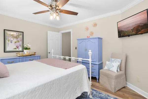 a living room with furniture pool table and windows