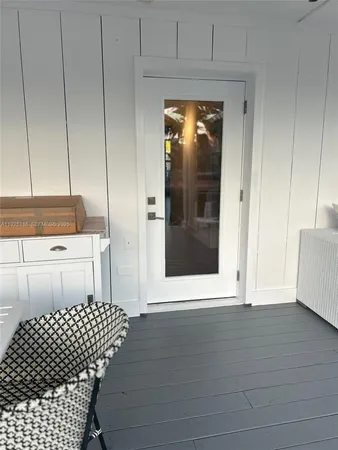 a bedroom with a bed and a night stand