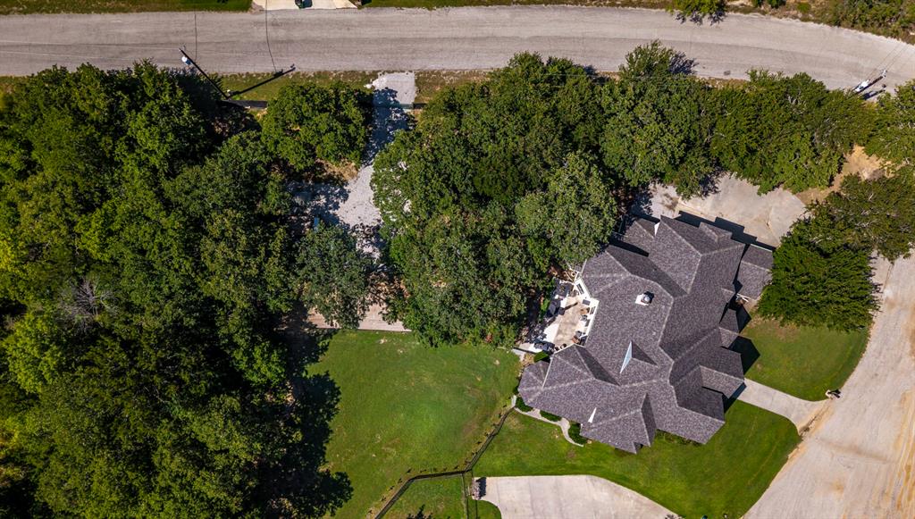 100 Manders Court Runaway Bay, TX 76426 - Photo 32 of 33 an aerial view of a house with outdoor space and street view